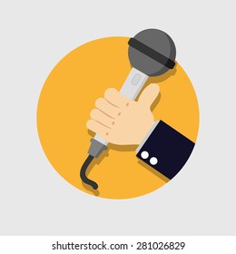 Hand holding a microphone