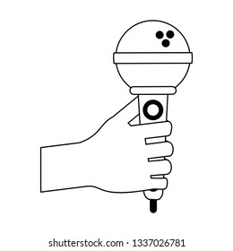 hand holding microphone in black and white