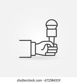 Hand holding microphone icon - vector outline symbol or design element