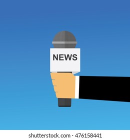 Hand holding microphone. Live news. 