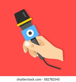 Hand holding microphone. Modern flat design vector illustration