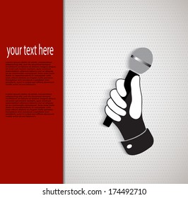 hand holding a microphone on background
