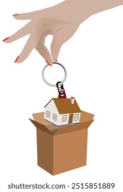 Hand holding a miniature house on a key chain over an open cardboard box suggesting a real estate transaction