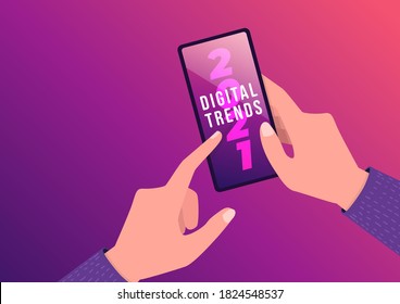 Hand Holding Mobile With Digital Trends 2021 On Screen. New Trends Digital Marketing, Business And Technology Concept.