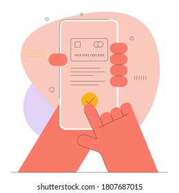 Hand is holding a mobile phone and approving an online payment with a credit card