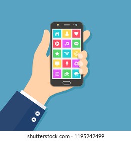 Hand holding mobile phone with colorful application icons on the screen. Flat design concept.