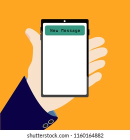 Hand holding mobile phone with new message notification on screen