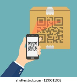 Hand holding mobile phone scanning QR code on cardboard box