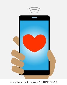 Hand holding a mobile phone and sending a love message heart. Valentines day greeting card.
