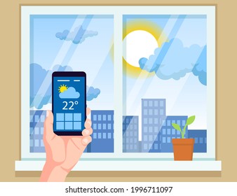 Hand holding mobile phone with weather app vector illustration. Checking weather forecast before leaving home. Window, city, sun in background. Technology, high temperature, meteorology concept