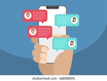 Hand holding modern bezel free / frameless smartphone with chat message notifications. Illustration of chatting speech bubbles as concept of chat, conversation, online dialog.