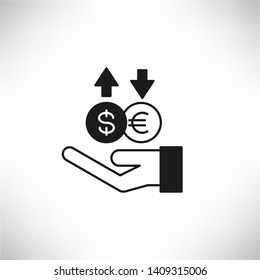 hand holding money coins for currency hedging concept