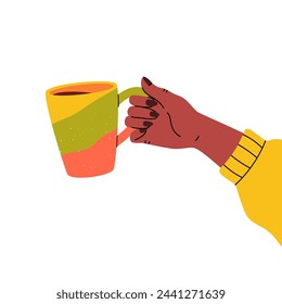 Hand holding a multi-colored mug