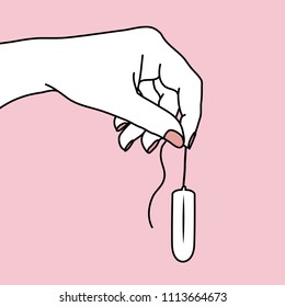 Hand holding a new tampon by the string without an applicator