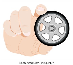 hand holding object-car wheel