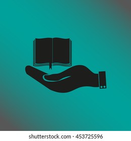 hand holding a open book