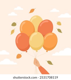 Mano sosteniendo globos naranjas y amarillos con hojas de otoño volando alrededor. Ilustración vectorial plana