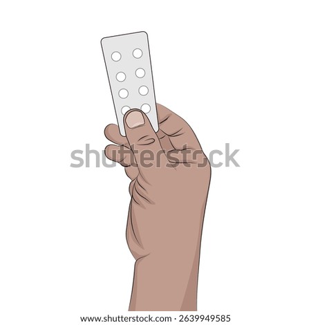 Hand holding pack of medicinal pills.