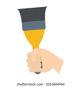 Hand holding paint brush