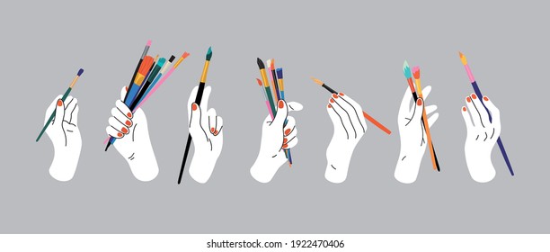 Hand holding paintbrushes. Hand drawn vector illustration of hands with art tools.  Doodle style. Workshop, art studio, workplace, artist, art shop, painting. Hand, palm, wrist, fingers, nails.