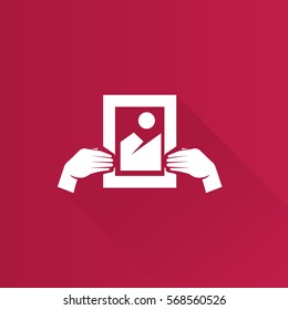 Hand holding painting icon in Metro user interface color style. Business concept auction bidding