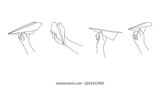 Hand holding a paper airplane. International Civil Aviation Day. Isolated on white background