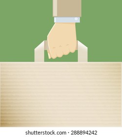 A hand holding a paper bag