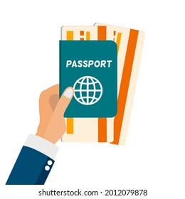 A hand holding passport and boarding pass, travel around the world concept