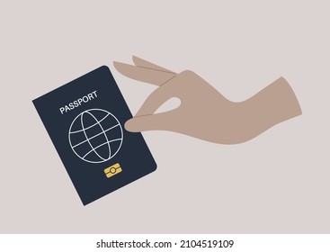 A hand holding a passport cover, a citizenship ID document