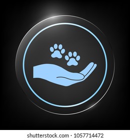 Hand holding paw symbol. Animal protection