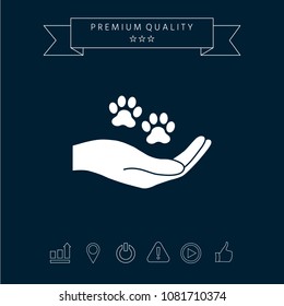 Hand holding paw symbol. Animal protection Hand holding paw symbol. Animal protection