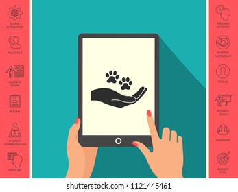 Hand holding paw symbol. Animal protection