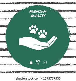 Hand holding paw symbol. Animal protection. Graphic elements for your design