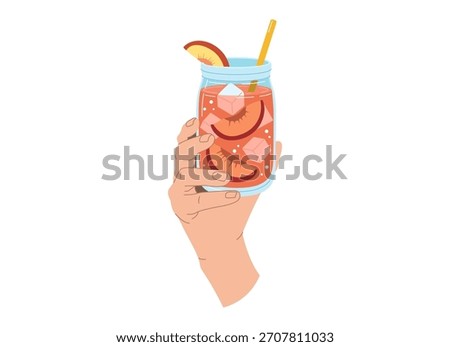 A hand holding a peach drink