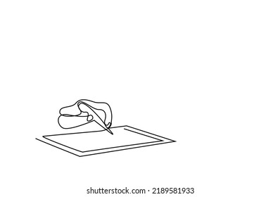 a hand holding a pen writes something on a tablet book