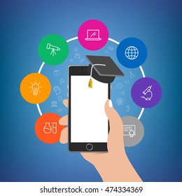 Hand holding phone with academy hat with more colorful icons around. Empty display. Useful for mobile applications, web design, social media advertisement posters, branding, flyers and brochures.