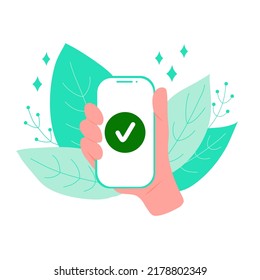 Mano sosteniendo el teléfono con marca de verificación, hojas en el fondo. Pago de cartera electrónica móvil o en línea
