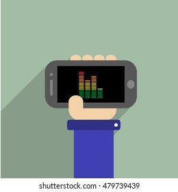 Hand holding a phone with equalizer