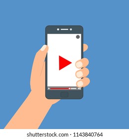 Hand holding phone icon. Vector illustration. There is a "play" button on the display of the smartphone in the picture