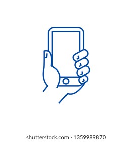 Hand holding phone line icon concept. Hand holding phone flat  vector symbol, sign, outline illustration.