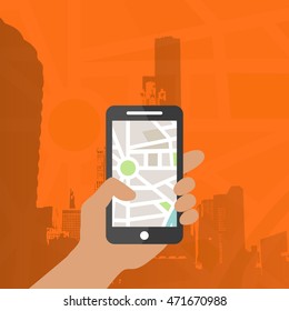 Hand holding phone with map application. GPS location map for mobile device.