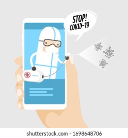 Hand holding phone with Medical worker with PPE suit getting rid of coronavirus germs by spraying disinfectant COVID-19 virus pathogen.