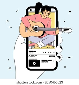 hand holding phone that shows video of young women playing guitar while singing on video sharing apps. used for poster, website image and other