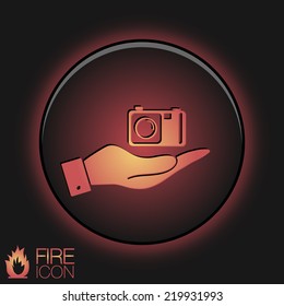 hand holding a photo camera