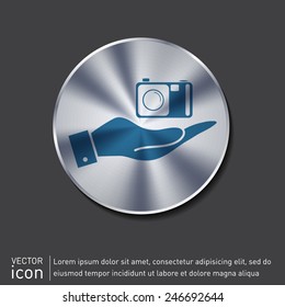 hand holding a photo camera