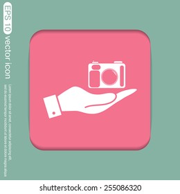 hand holding a photo camera