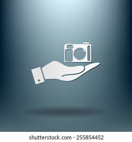 hand holding a photo camera