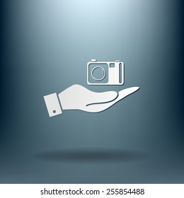 hand holding a photo camera