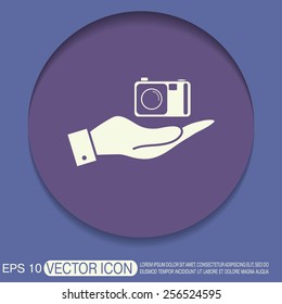 hand holding a photo camera