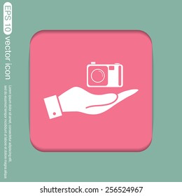 hand holding a photo camera